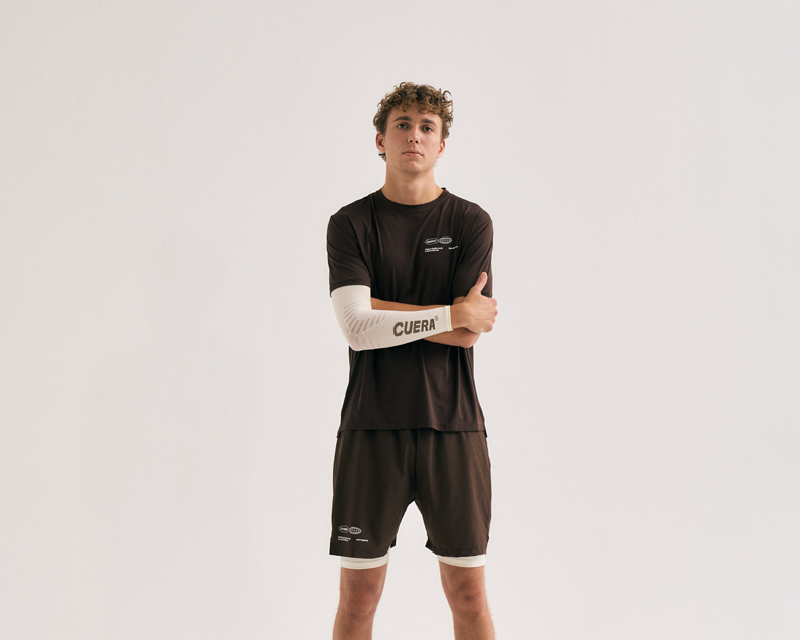 Male padel player showing Cuera compression sleeve